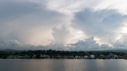 Naklejka na ściany i meble Storm clouds developing over waterfront, Honiara, Guadalcanal, Solomon Islands