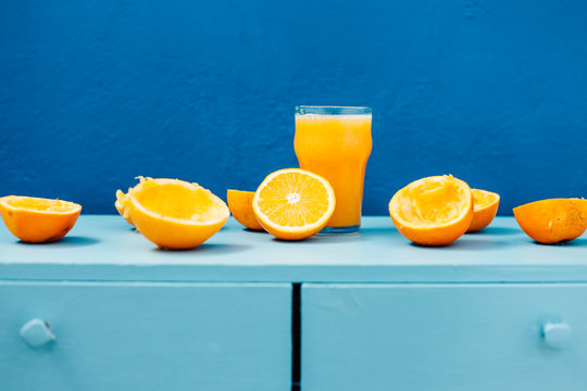 Orange juice on blue background