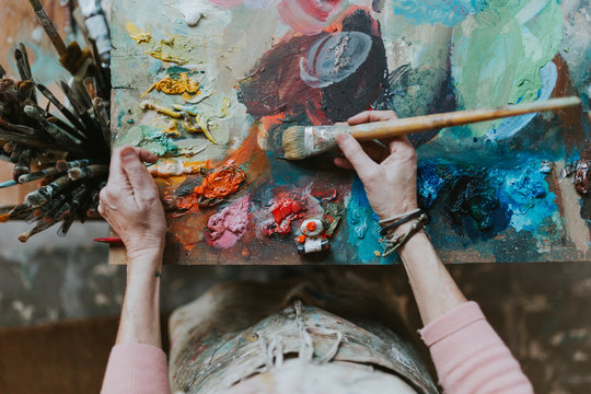 Woman painting in her art studio