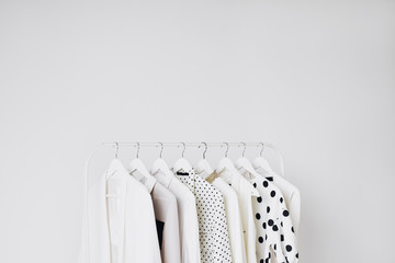 Blazers hanging on clothes rack