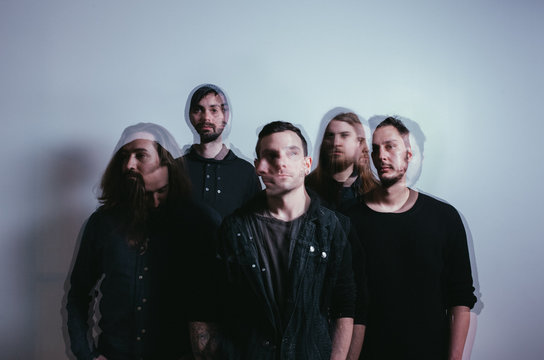 Double exposure of five member band on seamless background