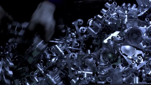 Factory Worker Stack Lot Of Newly Made Metal Parts