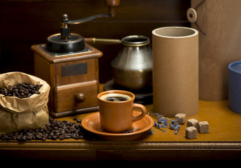 cup of coffee, turka, coffee beans and a coffee grinder, croissants