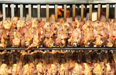 chicken meat cooked on a spit