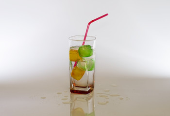 Iced cold sparkle water with colour cubes