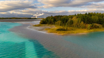 Turquoise water of lake powered by power plant mineral waste. Aerial view.