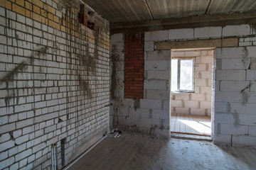 A room in a brick house under construction