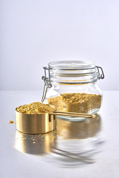 Nutrional Yeast, Used in Vegan and Dairy-Free Cooking as a replacement for cheese/dairy flavor.