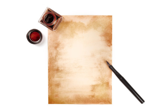 A vintage background. A piece of old paper with an ink pen and an ink well, shot from above on a white background with a place for text