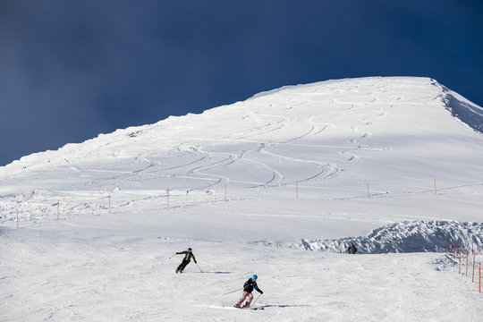 Skiers on slope in ski field