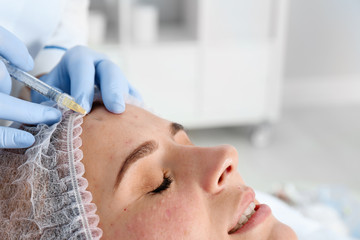 Obraz na płótnie Canvas Woman undergoing face biorevitalization procedure in salon, closeup. Cosmetic treatment