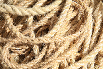 Natural hemp ropes as background, closeup view