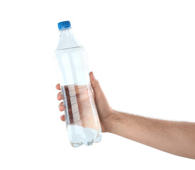 Man holding plastic bottle with water on white background