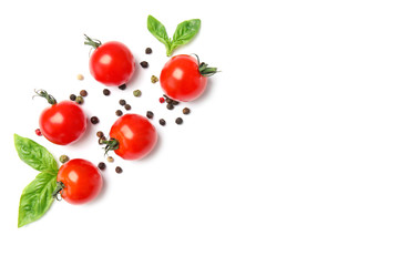 Fresh green basil leaves and cherry tomatoes on white background, top view