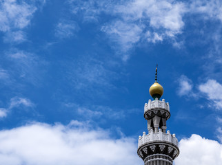 Top of mosque building in sunny day. Low angle view to a beautiful top roof of mosque, Orthodox architecture design, high tower in middle east Asia style. Muslim church, a place to worship.
