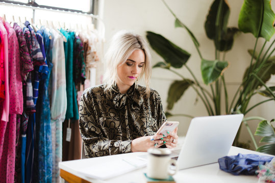Vintage fashion shop owner in her studio.