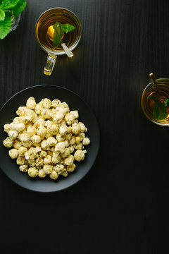 Peppermint and white chocolate popcorn with peppermint tea