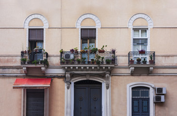 Fototapeta na wymiar View on street of Catania, Sicily, Italy - facade of an ancient building