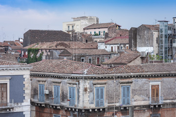 Fototapeta na wymiar Catania rooftops and cityscape in the background, Sicily, Italy
