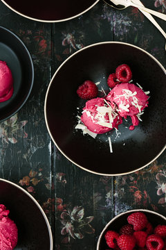 Raspberry sorbet with white chocolate shards and fresh berries