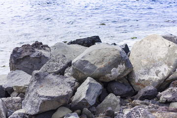 Rocky sea shore of Acitrezza next to Cyclops islands, Catania, Sicily, Italy