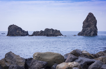 Fototapeta na wymiar Acitrezza rocks of the Cyclops, sea stacks in Catania, Sicily, Italy
