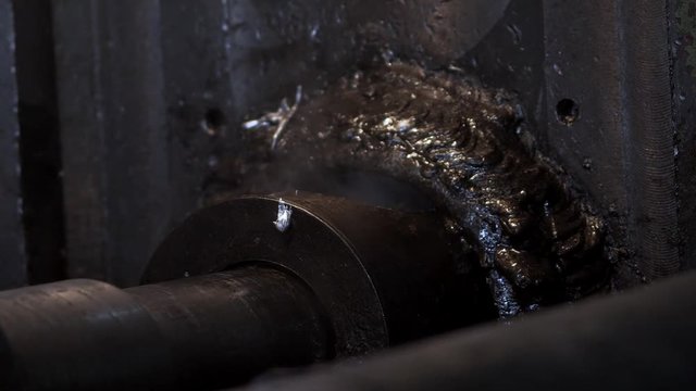 Smith Pours The Melted Metal From The Iron Ladle