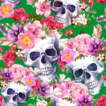 Human skulls with flowers, feathers for Day of Death or Halloween. Seamless pattern on green background. Watercolor