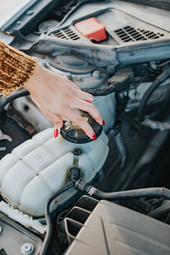 A woman with car problems