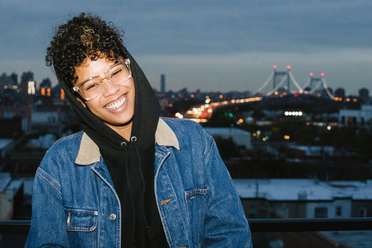 Portrait of happy woman on rooftop