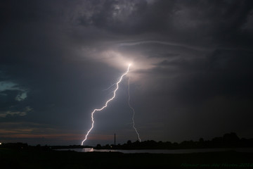 A Powerful Lightningbolt Strikes Outside the Storm