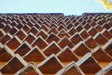 Small pyramids on the wall of the building