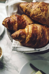 Breakfast with croissants, coffee and juice
