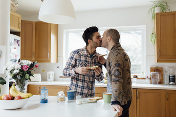 Male Gay Couple Preparing and Having Breakfast Together