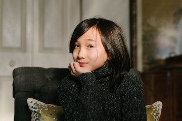 Cute multiracial boy in sweater