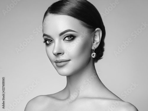 Beautiful Young Woman with Clean Fresh Skin. Perfect Makeup. Beauty Fashion. Eyelashes. Cosmetic Eyeshadow. Highlighting. Cosmetology, Beauty and Spa