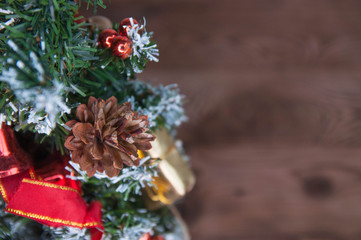 Happy new year and Merry Christmas concept. Christmas tree with new year decoration and bokeh on the wooden background.
