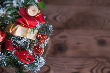 Happy new year and Merry Christmas concept. Christmas tree with new year decoration and bokeh on the wooden background.