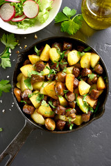Fried potatoes with mushroom and sausage