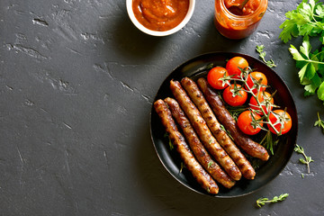 Fried sausages and cherry tomatoes