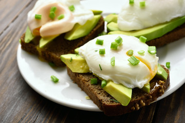 Sandwiches with poached eggs and avocado