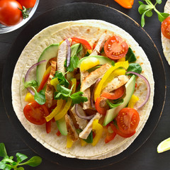 Taco with chicken meat and vegetables