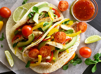 Tacos with chicken meat and vegetables