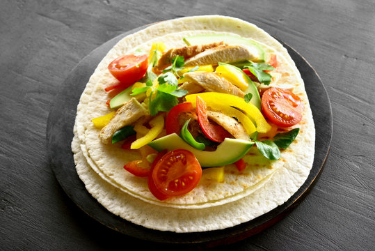 Taco with chicken meat and vegetables