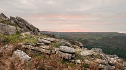 Stunning Autumn sunset landscape image of view from Leather Tor towards Burrator Reservoir in Dartmoor National Park