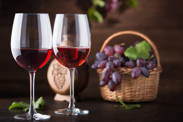 Red wine. Wine. Bottle and glasses of Red wine with ripe grapes.