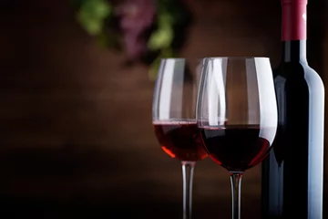 Fotobehang Red wine. Wine. Bottle and glasses of Red wine with ripe grapes. © Nelea Reazanteva