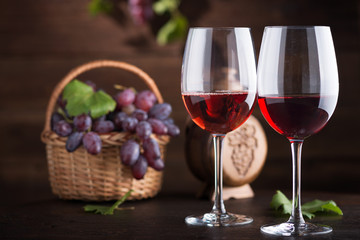 Red wine. Wine. Bottle and glasses of Red wine with ripe grapes.