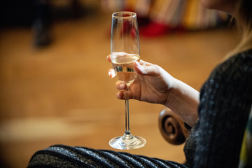 Glass of white wine in hand