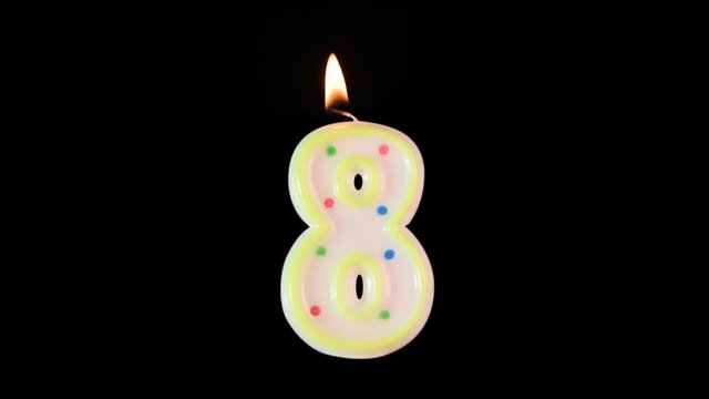 Wax candle in shape of number 8 burns. A nice addition to your birthday video. Made with alpha matte - background is transparent.